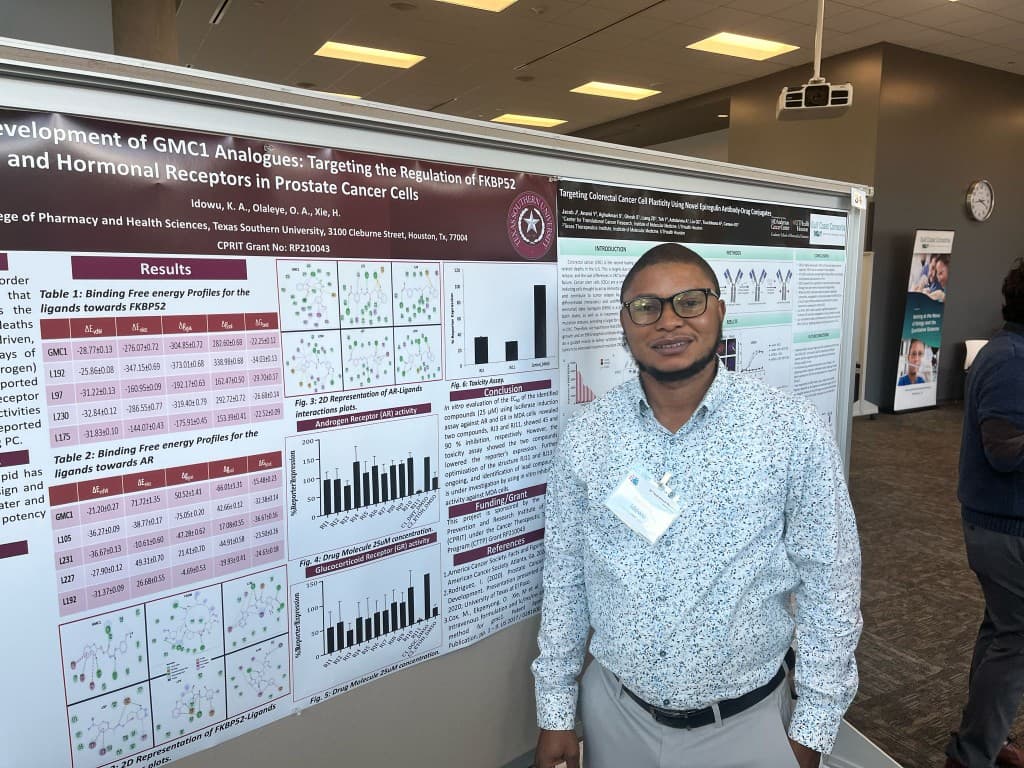 Researcher presenting prostate cancer ligand research at a Gulf Coast Consortia poster session