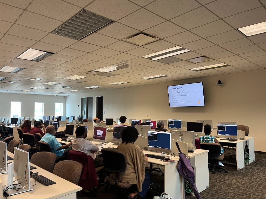 Workshop participants viewing a Common Commands presentation in the BioRacc computer lab