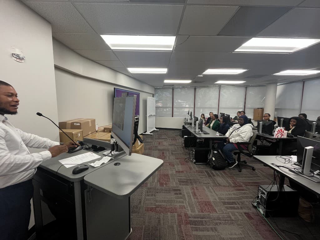 Instructor presenting at the podium during a BioRacc training workshop